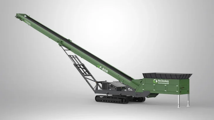 McCloskey EF-80R tracked radial stacker with large loading hopper and raised conveyor for stockpile building.