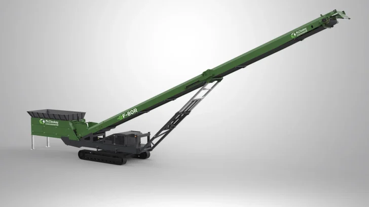 Angled view of the EF-80R Radial Stacker with compact tracked base, large hopper, hydraulic frame, and long discharge conveyor.