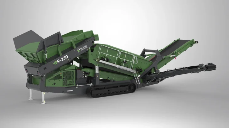Side view of the McCloskey Environmental ER-230 Screener showing the lined feed hopper, screenbox, tracks, and discharge conveyors.