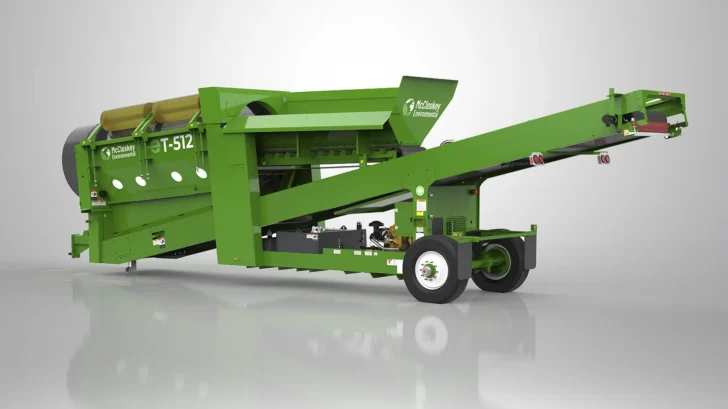 Side view of the ET-512A Trommel showing the feed hopper, drum section, wheels, and extended discharge conveyor.