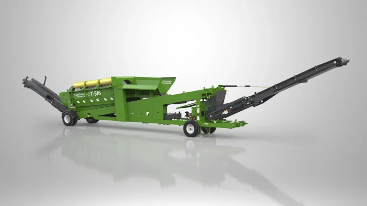 Angled view of the ET-516RE Trommel showing the feed hopper, wheeled undercarriage, drum section, and extended conveyors.