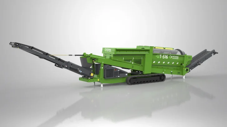 McCloskey Environmental Trommel with tracks, feed conveyor, screen drum, and radial conveyor extended.
