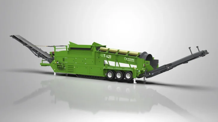 Rear angle of the Trommel showing wheels, support legs, drum enclosure, and extended discharge conveyors.